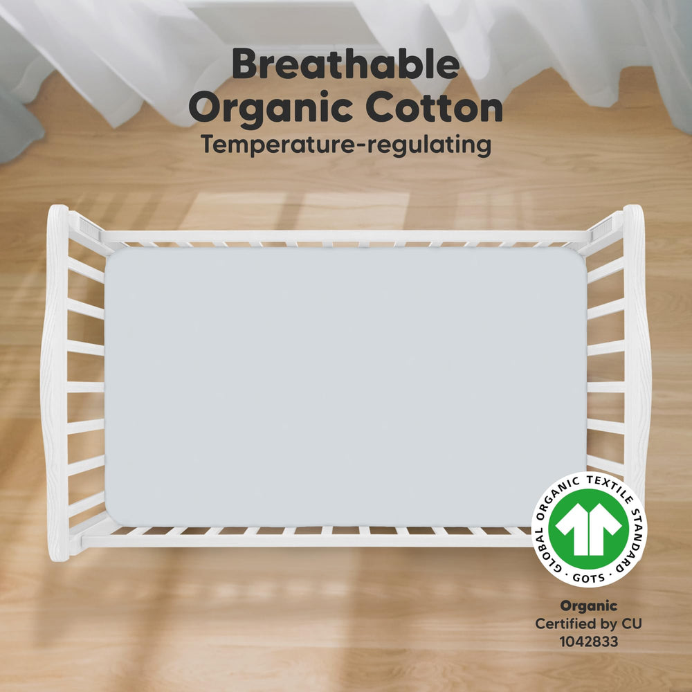 KeaBabies hazy print crib sheet on standard mattress showcasing snugfit stretch.