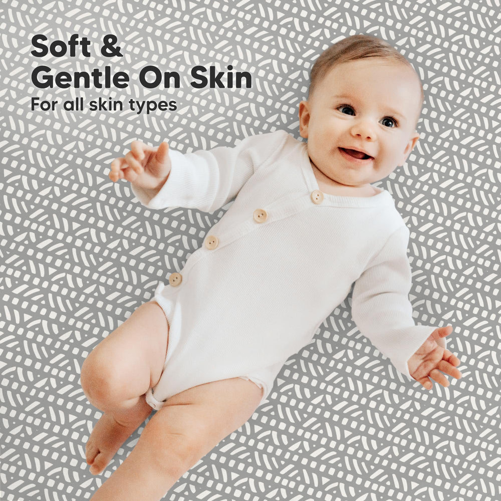 KeaBabies hidden elastic band secures a snug fit on a sleeping mini mattress.