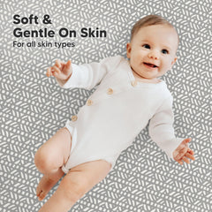 KeaBabies hidden elastic band secures a snug fit on a sleeping mini mattress.