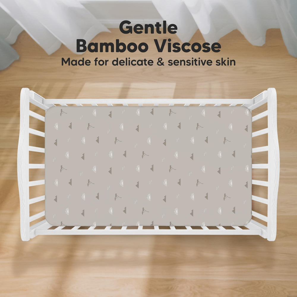 KeaBabies Isla fitted crib sheet demonstrates SnugFit Tech for easy on and off.