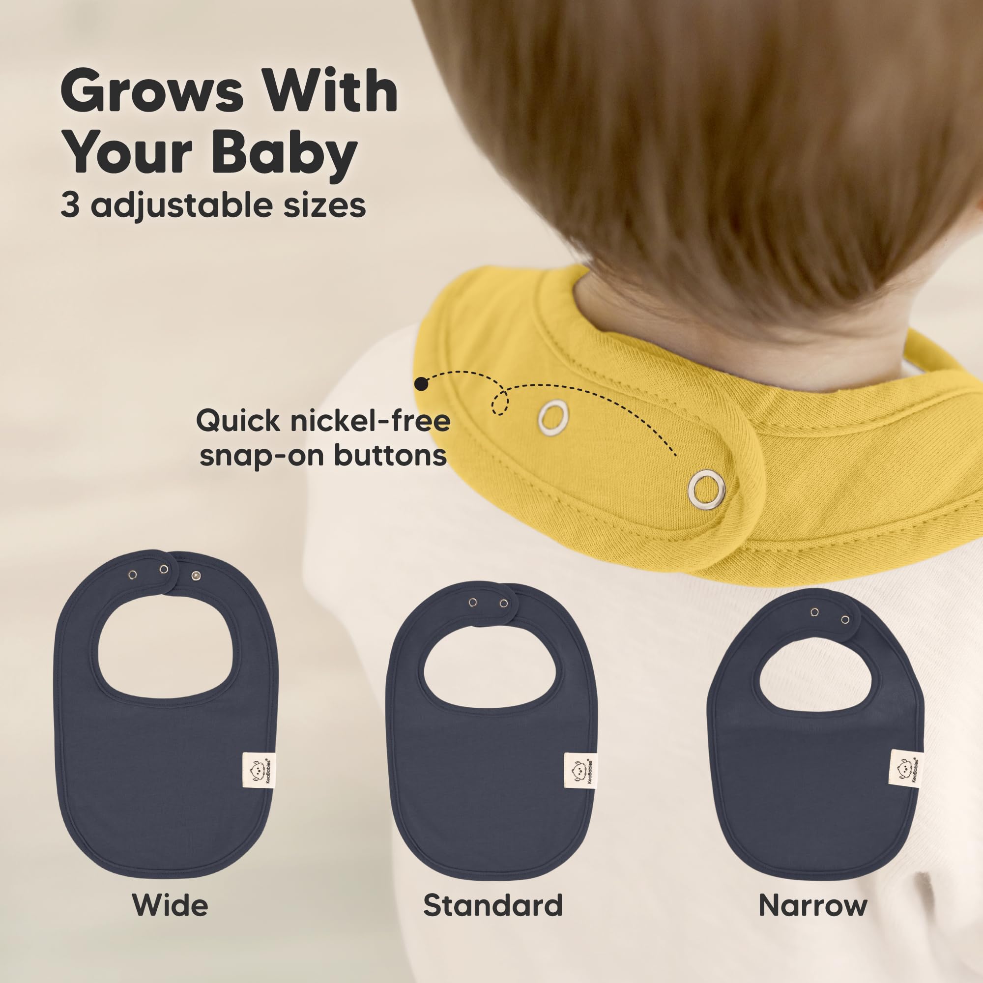 KeaBabies large-cover bib on baby chest providing full torso protection.