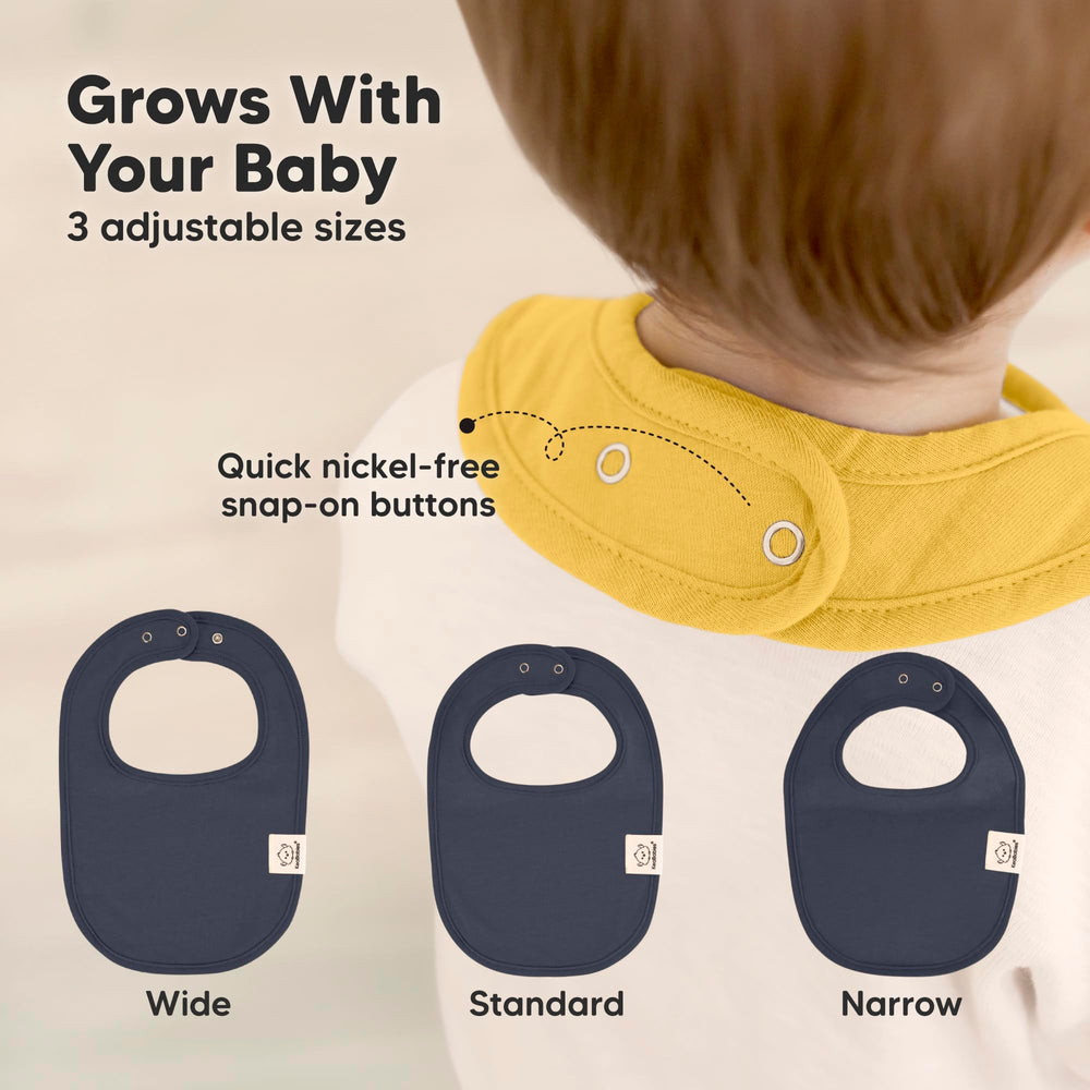 KeaBabies large-cover bib on baby chest providing full torso protection.