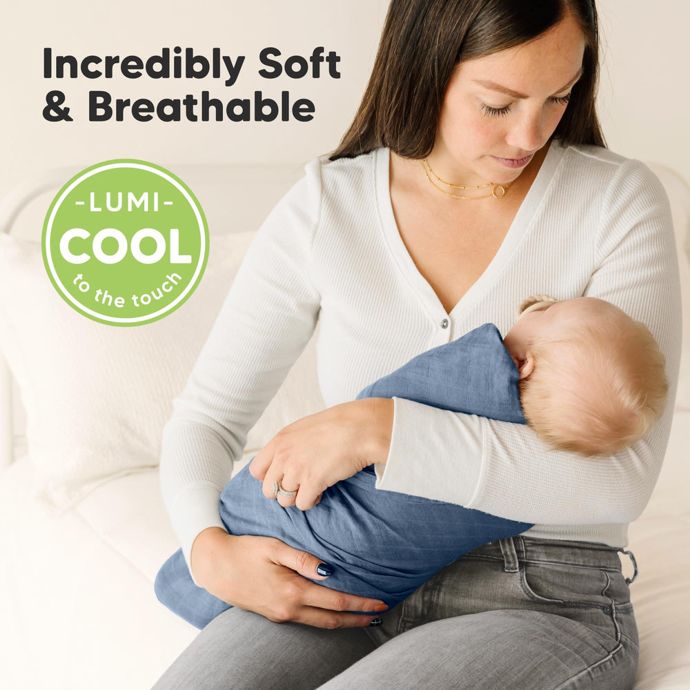 KeaBabies Lumi Muslin Swaddle Coral on baby demonstrating breathable comfort