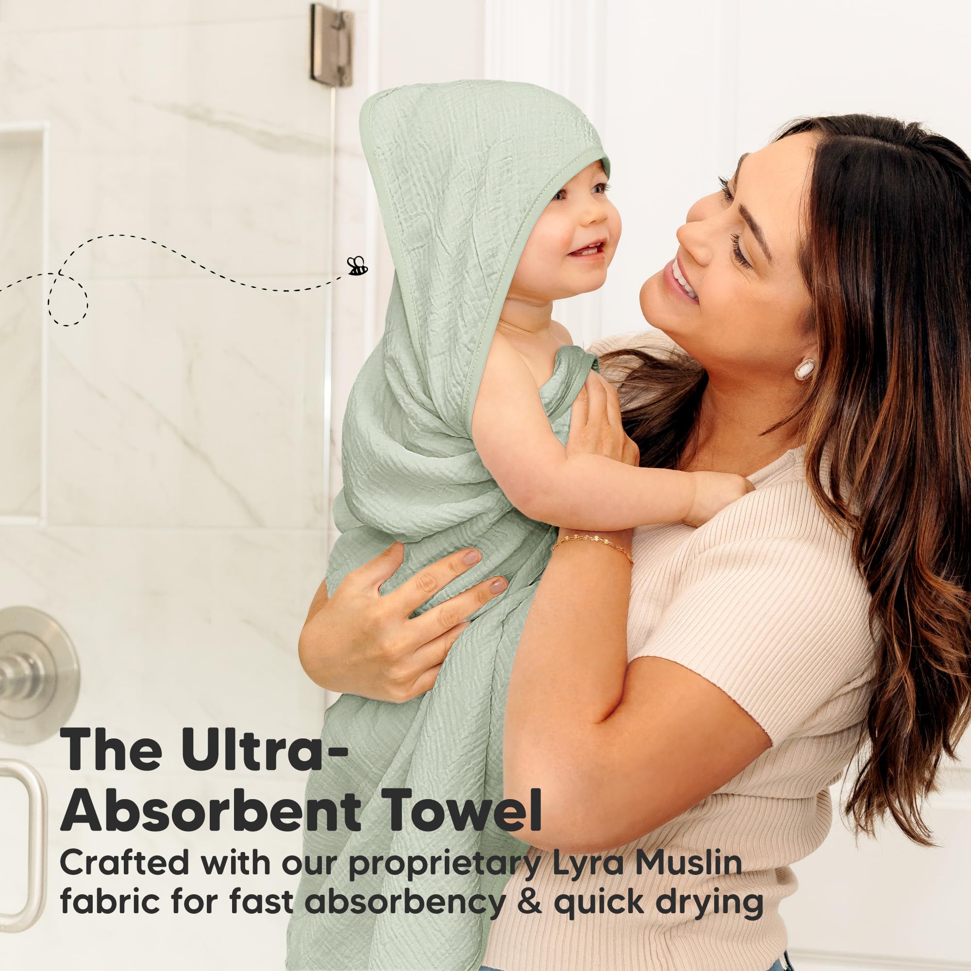 KeaBabies Lyra hooded towel wrapped around baby after bath.