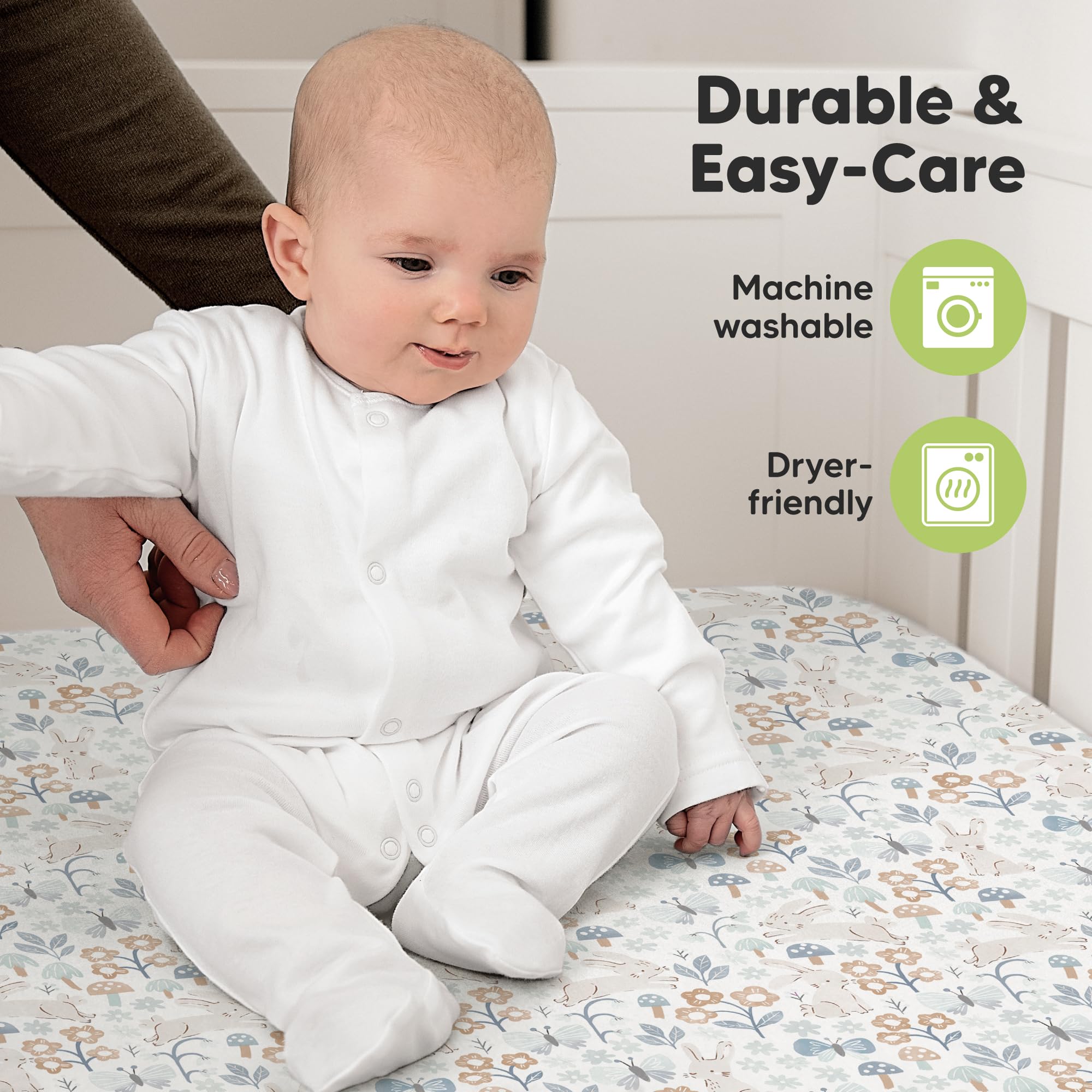 KeaBabies machine washable and dryer-friendly crib sheets shown with laundry