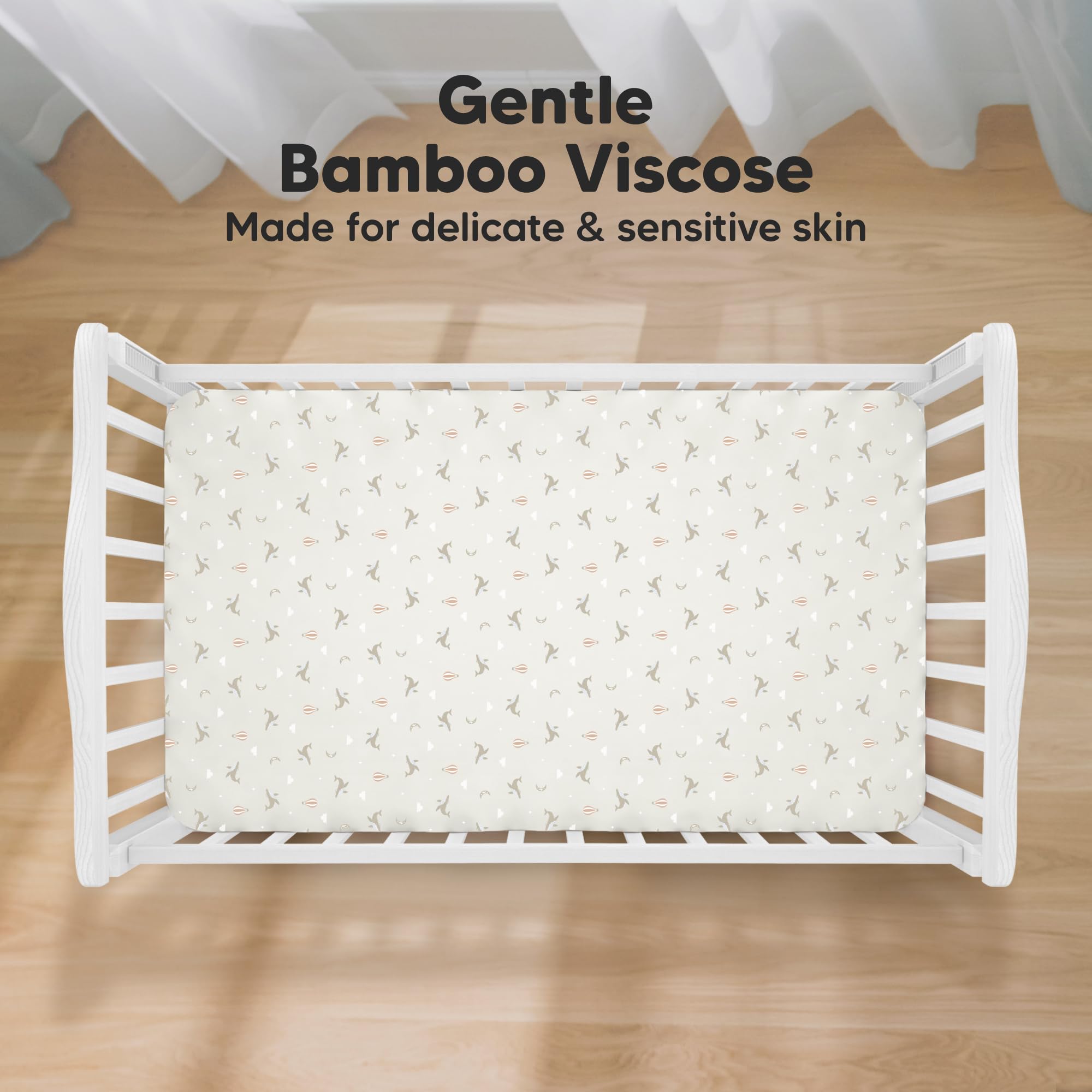 KeaBabies Marine Muse crib sheet on mattress demonstrates snug fit for easy changes