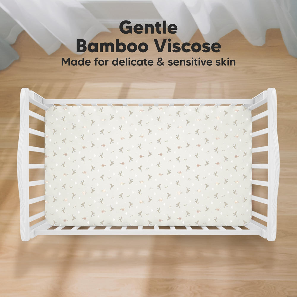 KeaBabies Marine Muse crib sheet on mattress demonstrates snug fit for easy changes