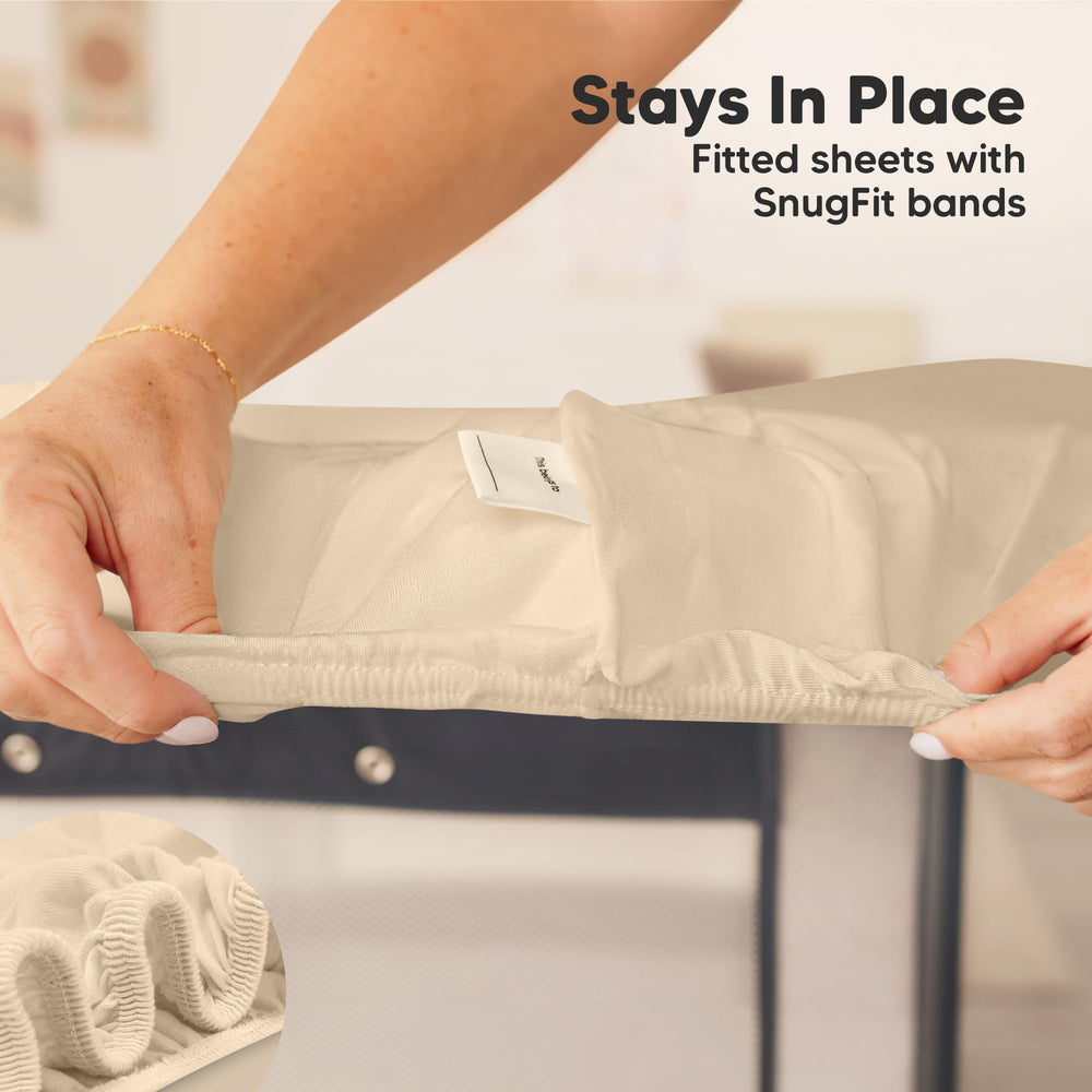 KeaBabies mini crib sheet on a pack n play mattress demonstrates proper fit.
