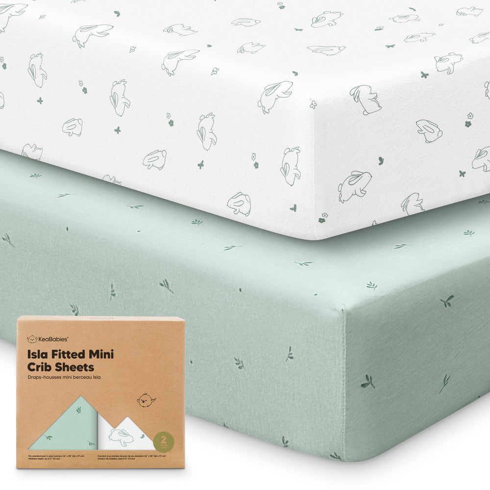 KeaBabies pack-n-play-sheets-2pack-set on a mattress, easy care for busy households.