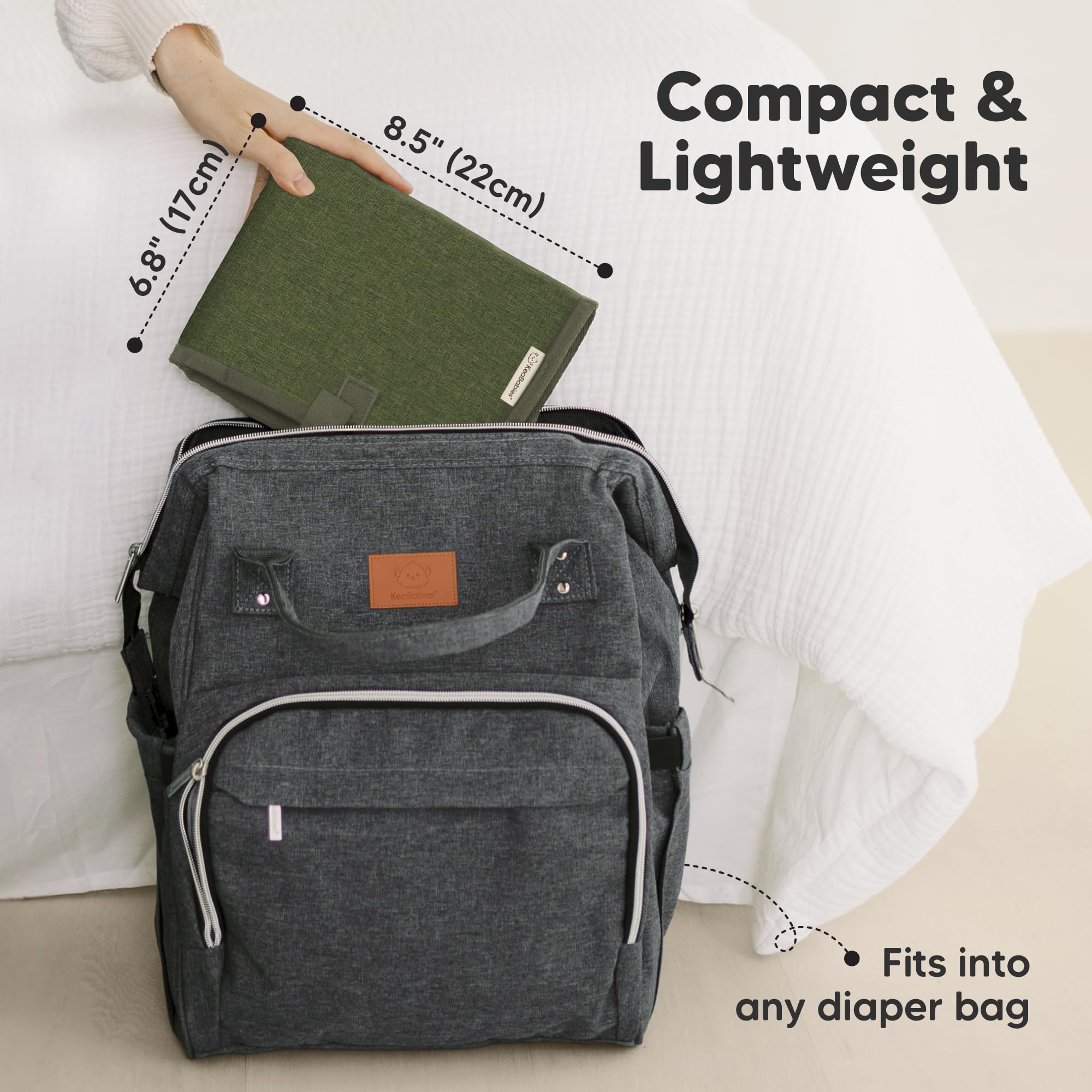 KeaBabies portable changing pad in olive green, folded compact, fits easily in your diaper bag.