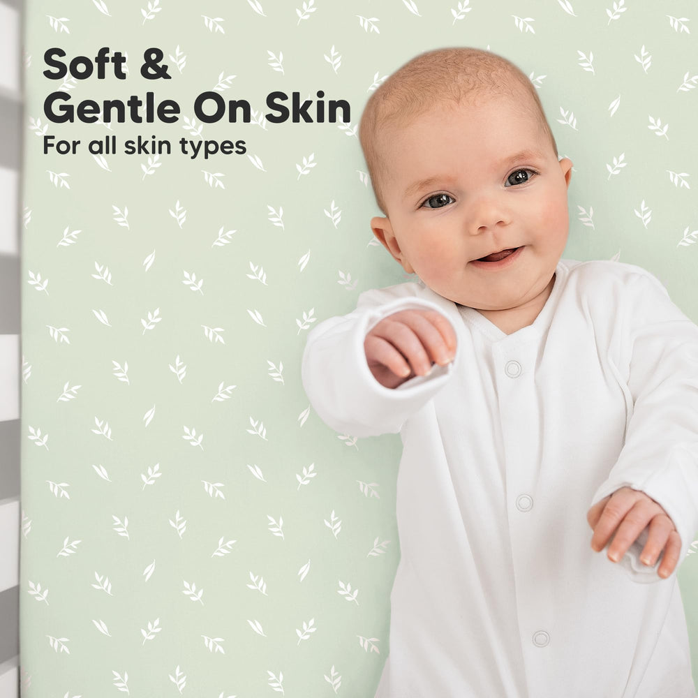 KeaBabies SnugFit Band crib sheet demonstrates concealed elastic for secure placement.