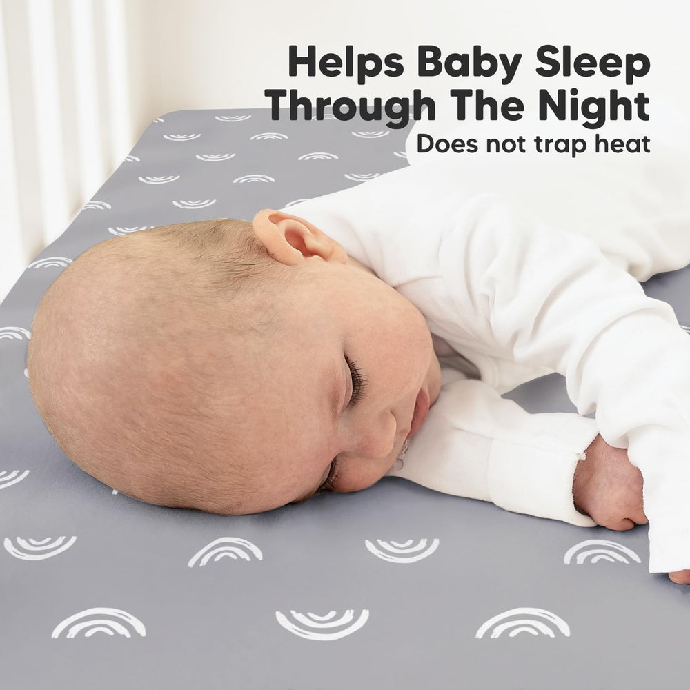 KeaBabies hidden SnugFit Band secures sheets during baby sleep.