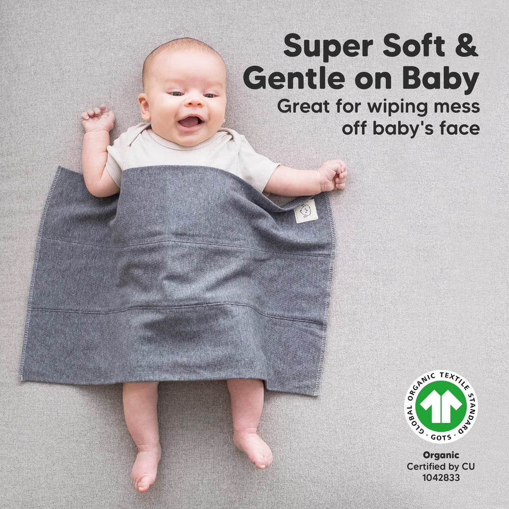 KeaBabies ultra-absorbent burp cloth catching liquid on the shoulder.