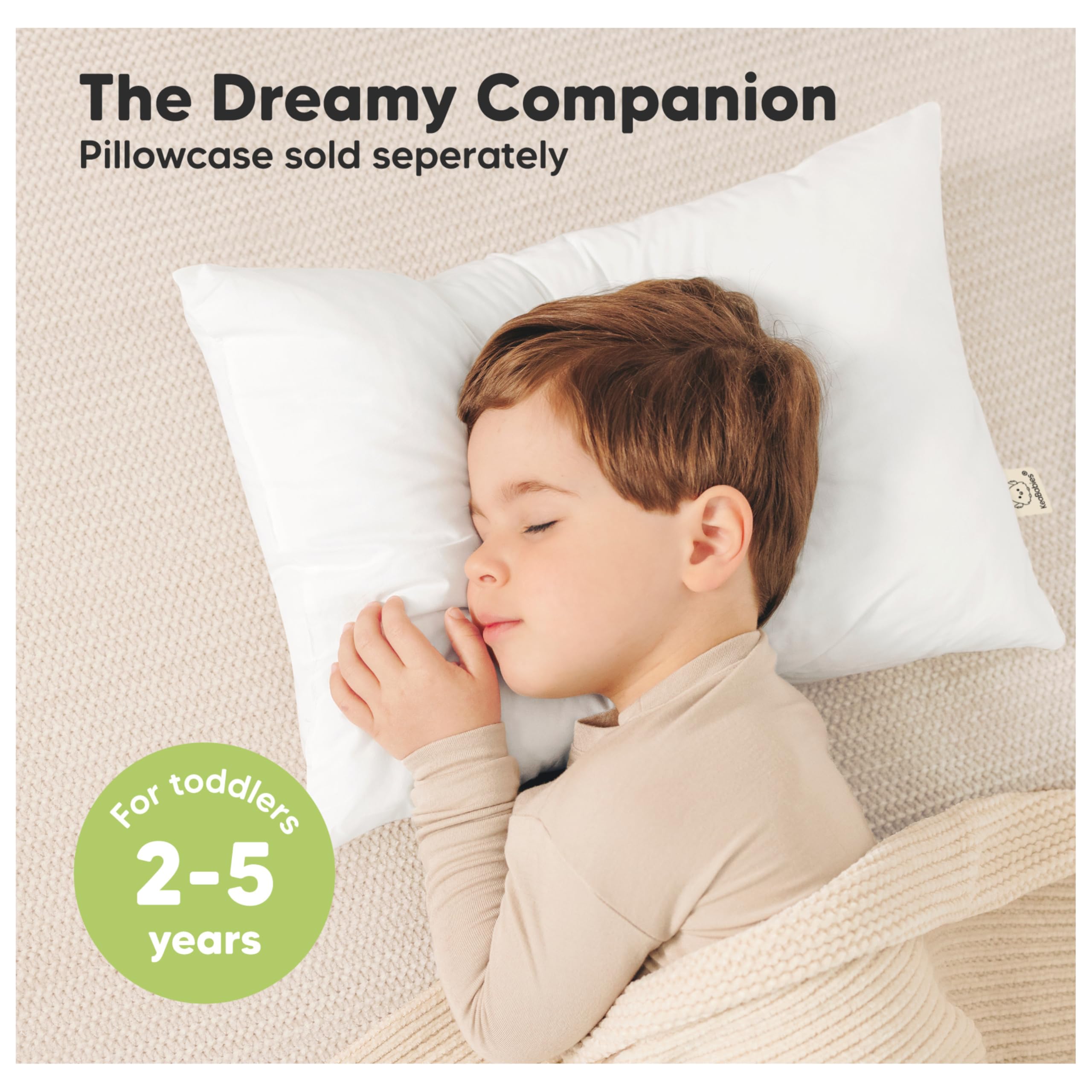 KeaBabies ergonomic toddler pillow close-up illustrates spinal-support design for growing kids.