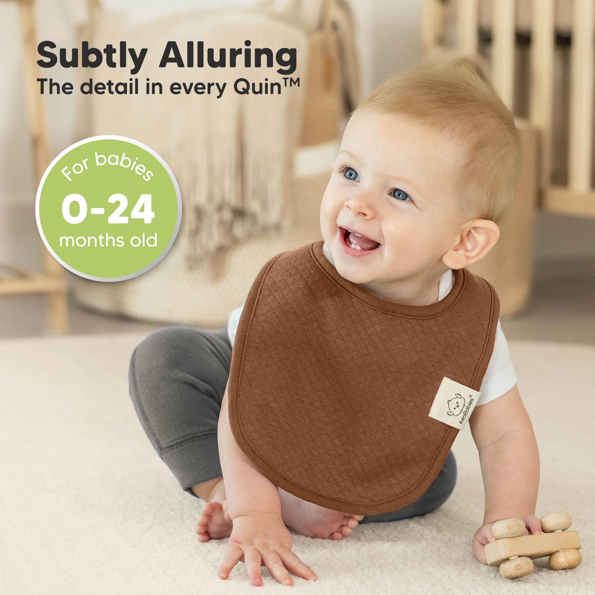 KeaBabies Urban Quin bib with adjustable snaps showing secure fit.