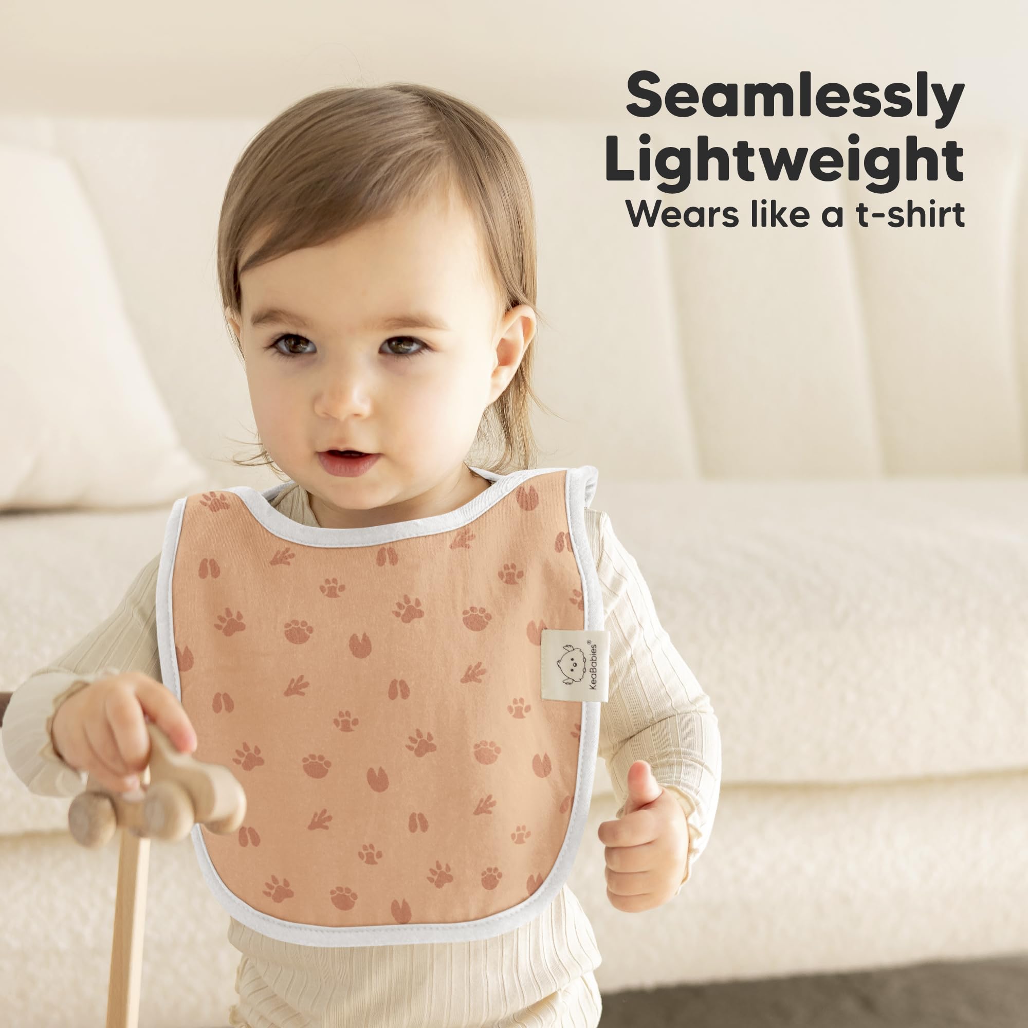 KeaBabies Wilderness bib full-body-fit demonstrates generous torso coverage