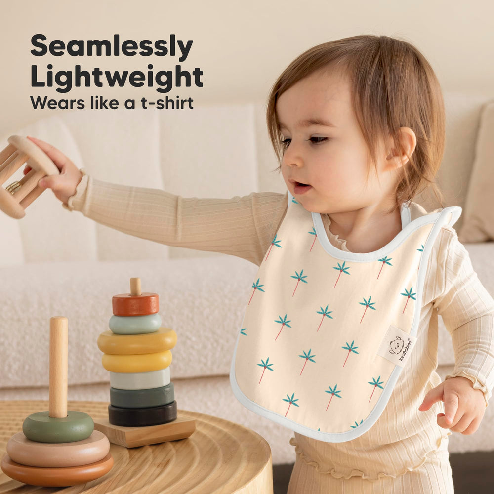 KeaBabies Wildscape baby wearing pullover bib during mealtime
