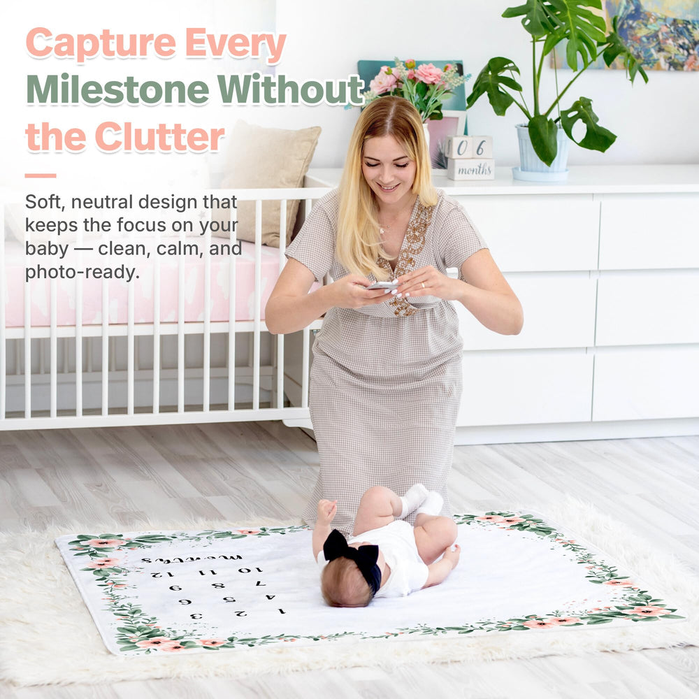 KEMINA BLANKETS monthly milestone prop highlights growth with a soft, floral setting.