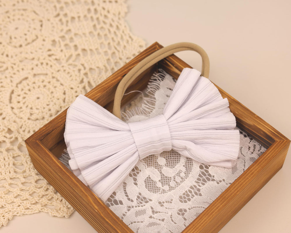 Kenjudess navy-blue headband with oversized bow making a cute gift idea