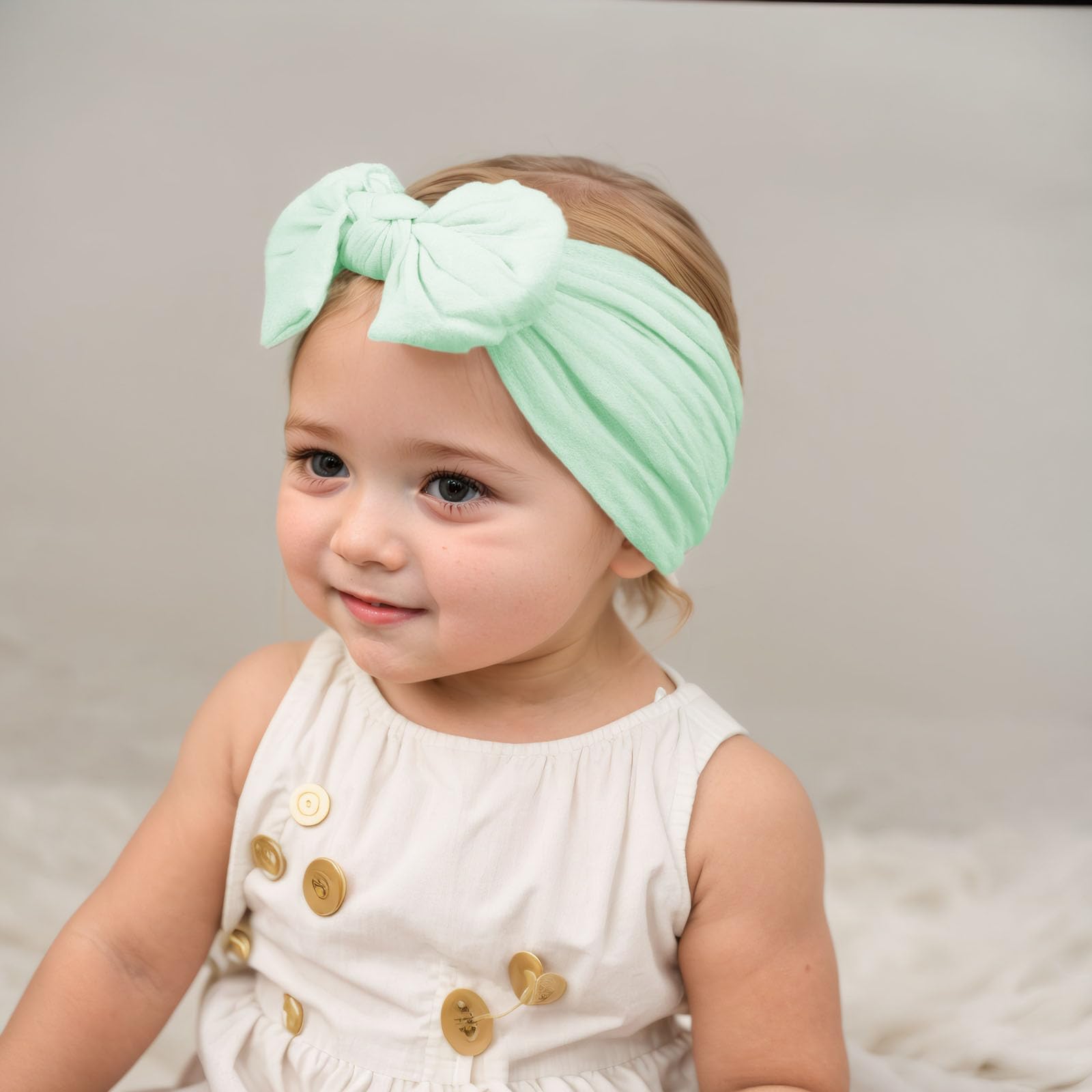 Kenjudess nylon headband close-up showing oversized knot bow and softness.