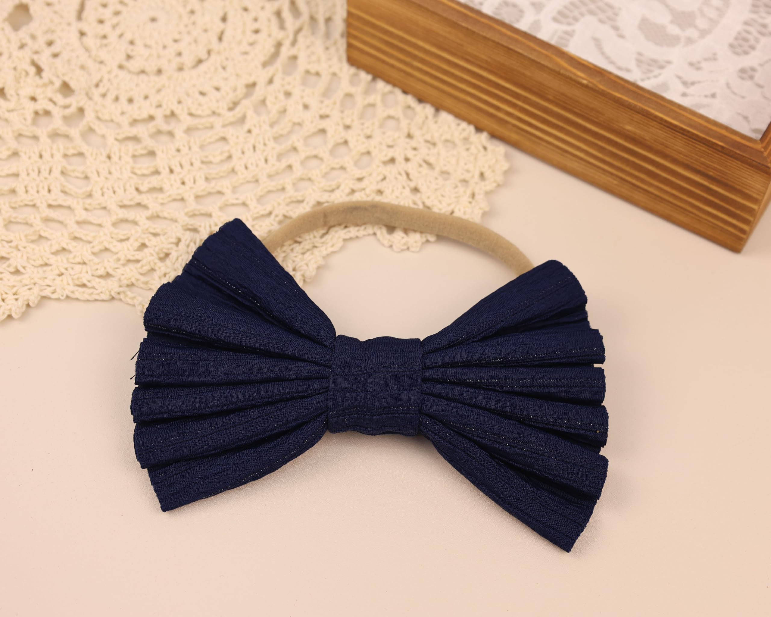 Kenjudess oversized bow adds whimsical charm for photoshoots.