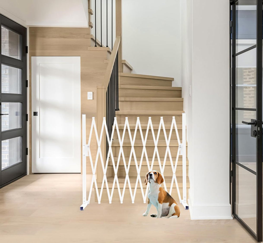 KENNISI metal expandable dog gate in a narrow opening showing compact width.