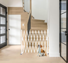 KENNISI metal expandable dog gate in a narrow opening showing compact width.