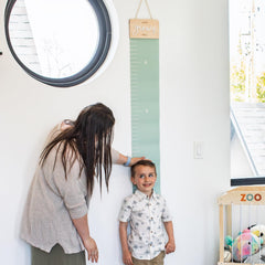KIBAGA growth chart wall milestones close-up with milestone markers and easy writing area.