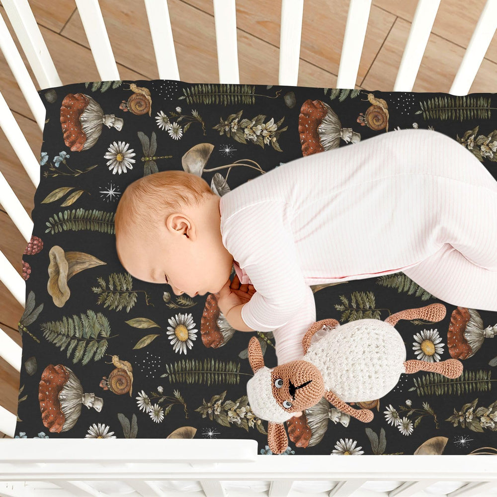 KICPOAY Vintage Mushroom Forest baby nap space arranged neatly on sheets.