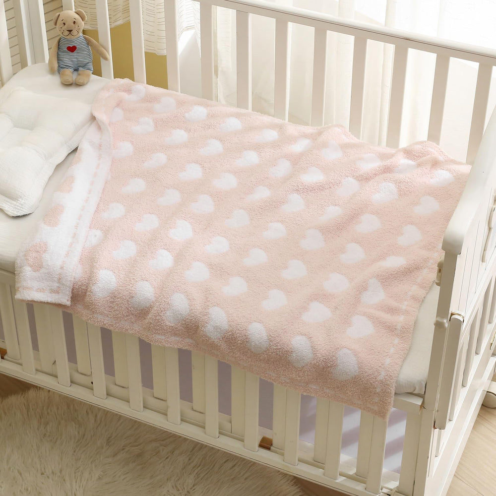 Kid Nation 30x40 inch blanket shown in crib for baby warmth and comfort.
