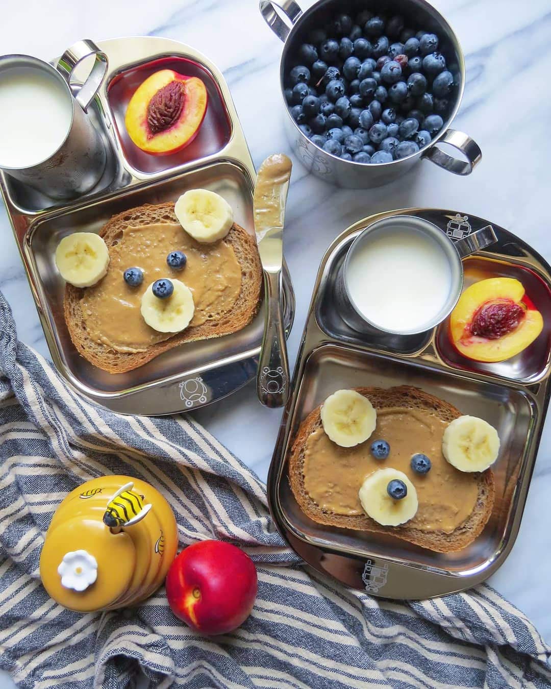 Kiddobloom frog-design utensils highlight playful touch for child-friendly mealtime.