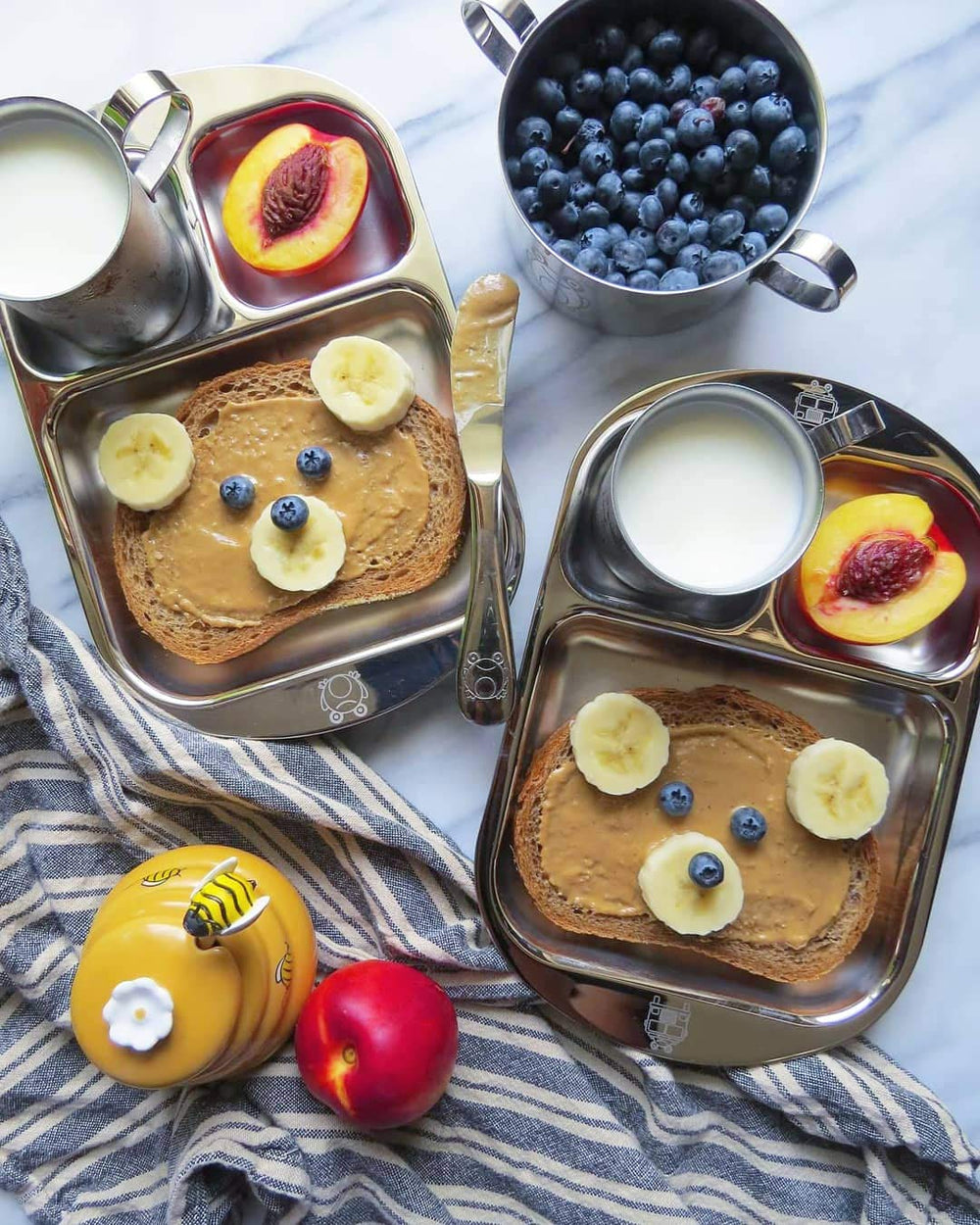 Kiddobloom frog-design utensils highlight playful touch for child-friendly mealtime.