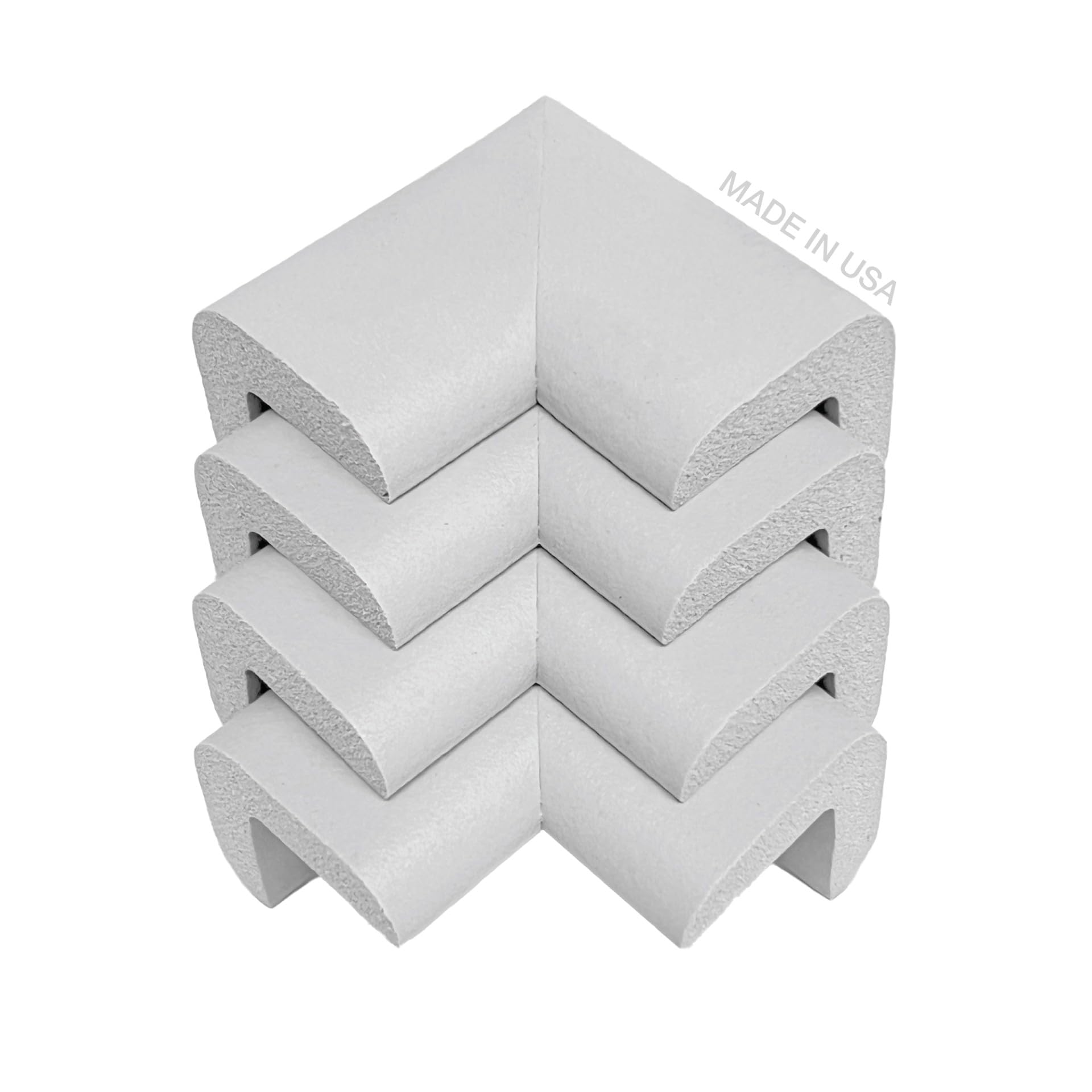 KidKusion soft gray corner cushion close-up demonstrates protective padding for furniture edges.