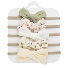 KIDOCHEESE Baby Bows soft fabric closeup highlights gentle, comfortable wear for delicate skin.