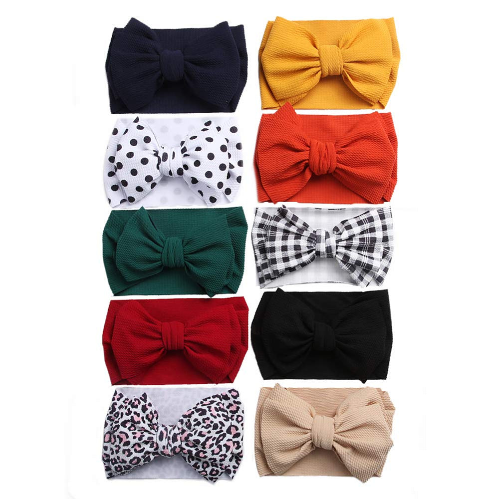 KIDOCHEESE big bows headband newborn close-up highlighting gentle fabric and secure fit.