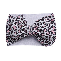 KIDOCHEESE big bows headband toddler view shows elastic band for comfortable all-day wear.