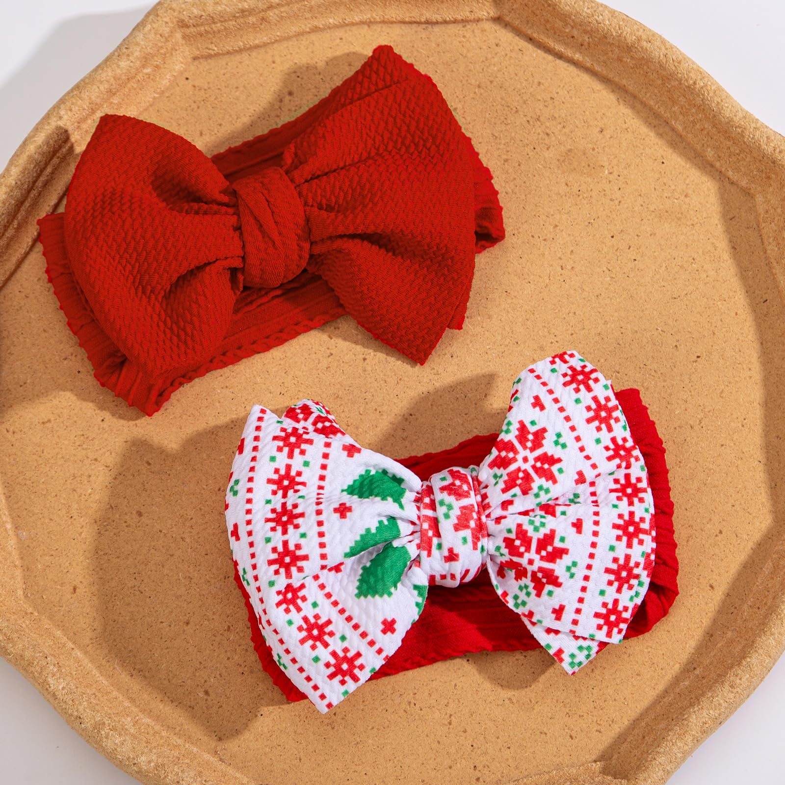 KIDOCHEESE Christmas baby bows elastic band stretch demonstrates one-size-fits-all versatility.