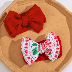 KIDOCHEESE Christmas baby bows elastic band stretch demonstrates one-size-fits-all versatility.