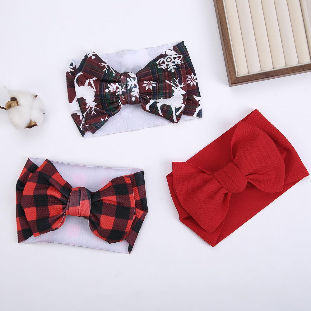 KIDOCHEESE Christmas baby bows packaging; gift-ready presentation for holidays.