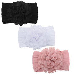 KIDOCHEESE flower headband in soft fabric for newborn comfort.