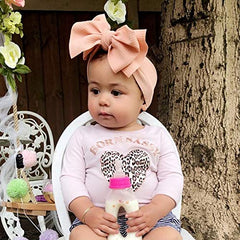 KIDOCHEESE bow headband with stretchy band for growing heads.