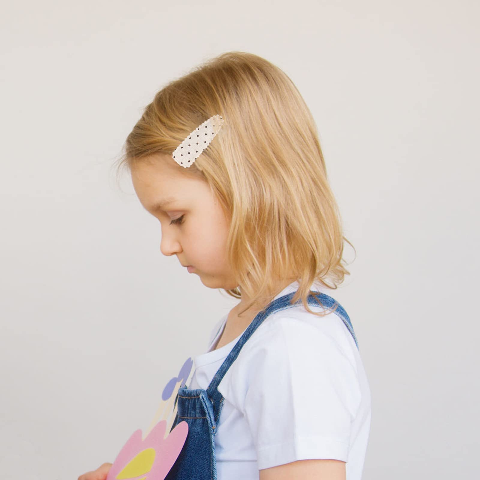 KIDOCHEESE two-and-a-half-inch clip keeps hair away from eyes during play