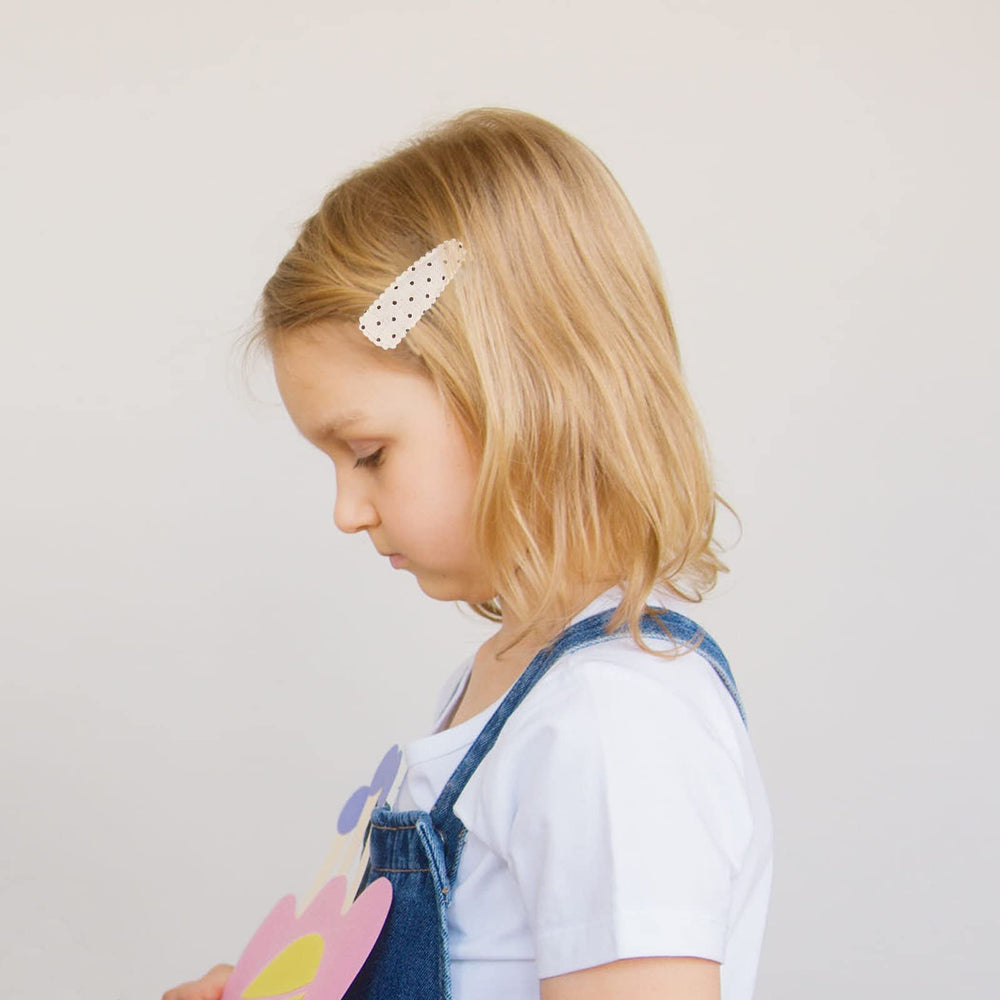 KIDOCHEESE two-and-a-half-inch clip keeps hair away from eyes during play