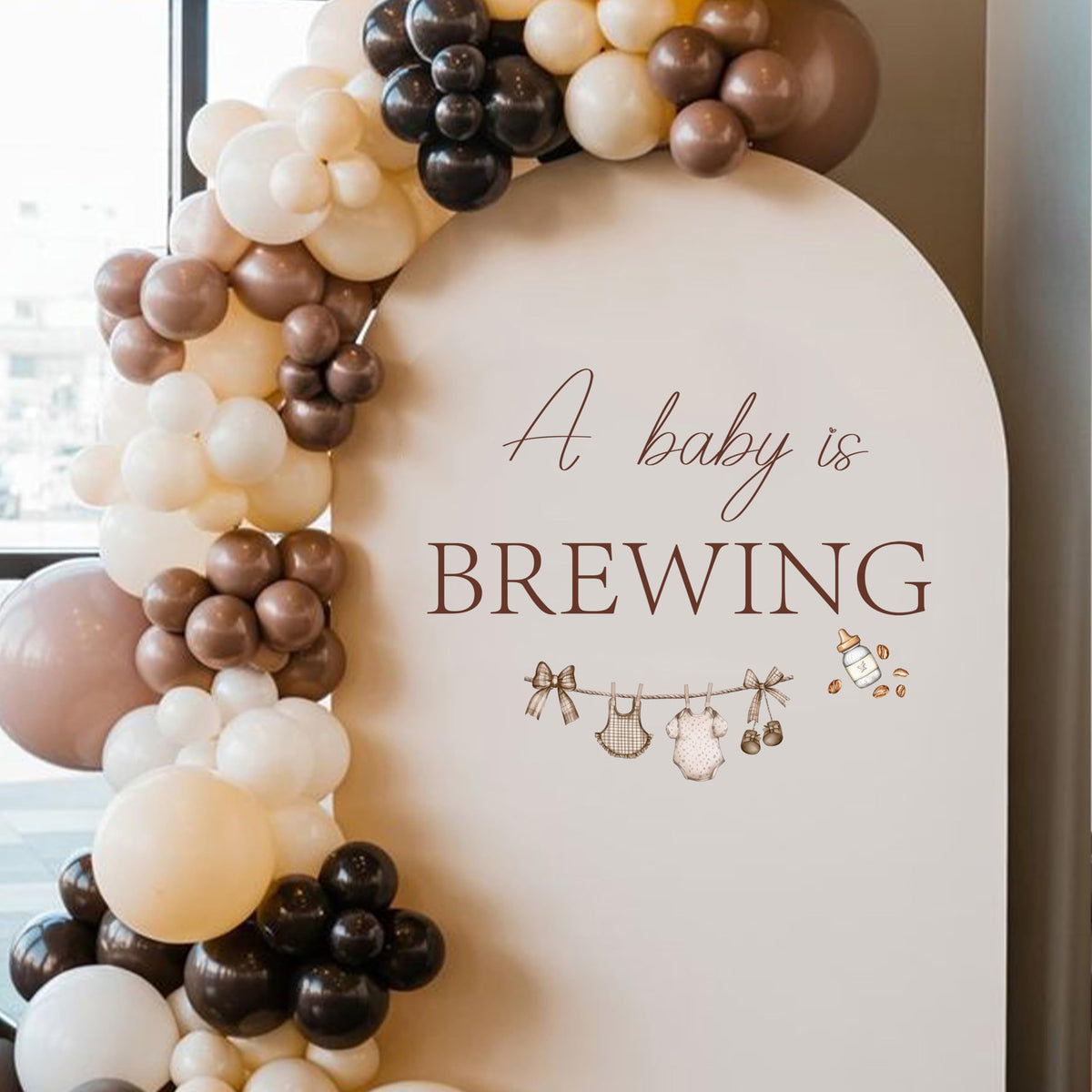 KIETKIE A Baby is Brewing wall decal features coffee cups for a warm baby shower backdrop