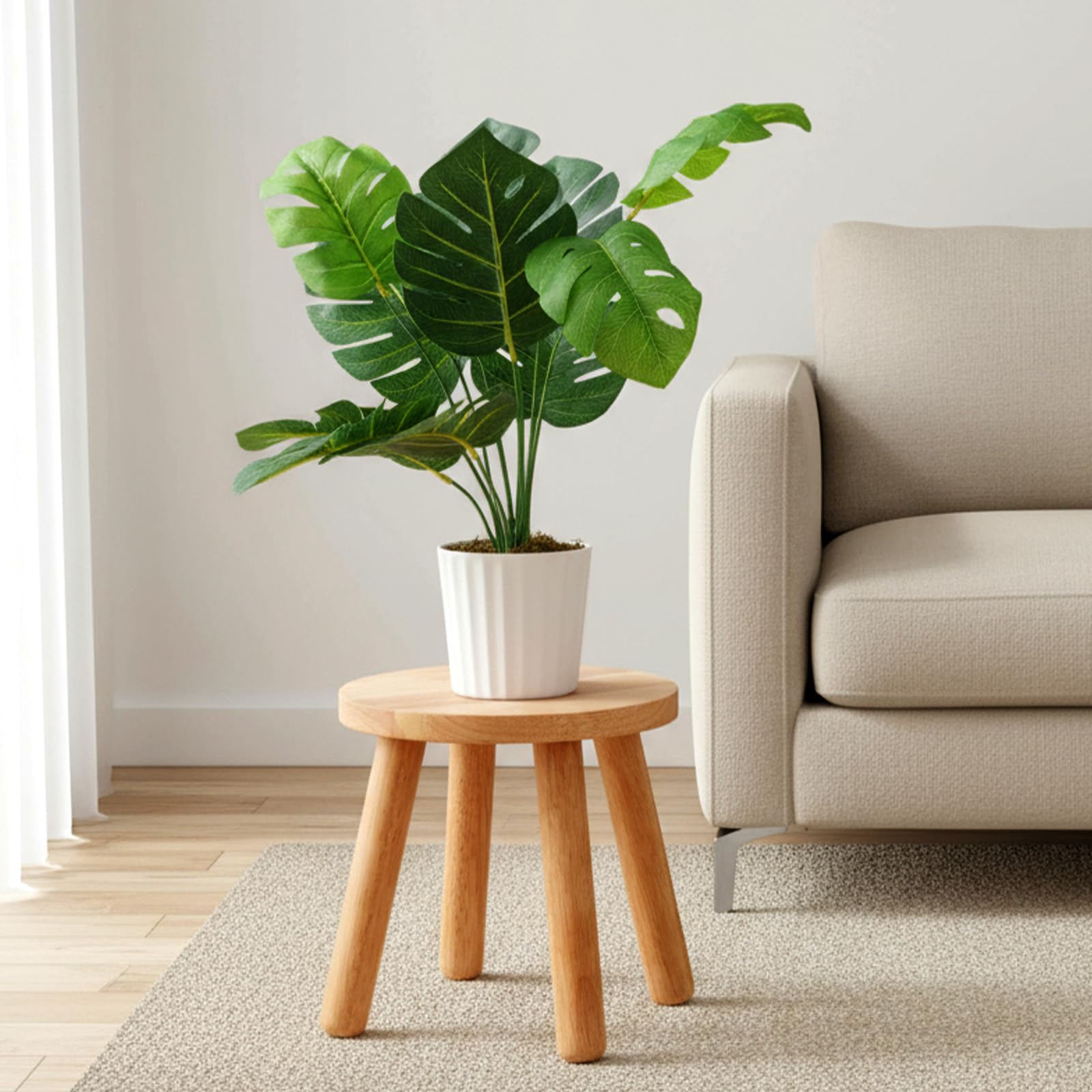 Kifmurase step stool doubles as a plant stand for indoor greenery.