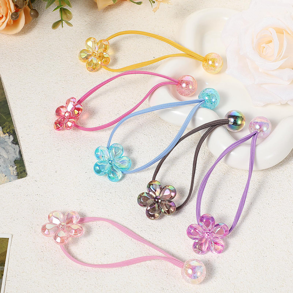 Kifmurase yellow camellia ball hair tie provides bright accent with secure, comfortable hold.
