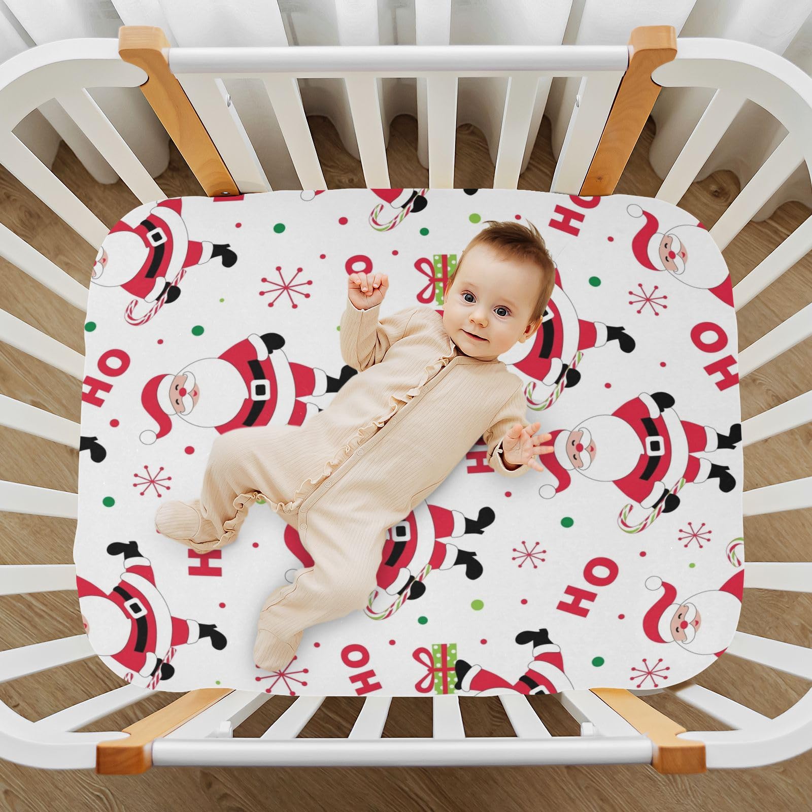 Kigai Santa crib sheet on crib from another angle for size perspective