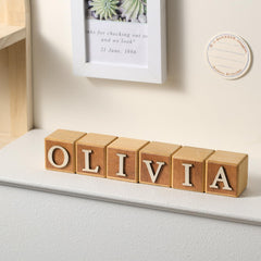 Kigley name-sign blocks with adhesive tools for quick customization.