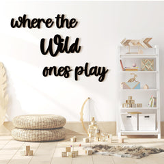 Kigley where-the-wild-ones-play wall sign forms a bold nursery focal point.