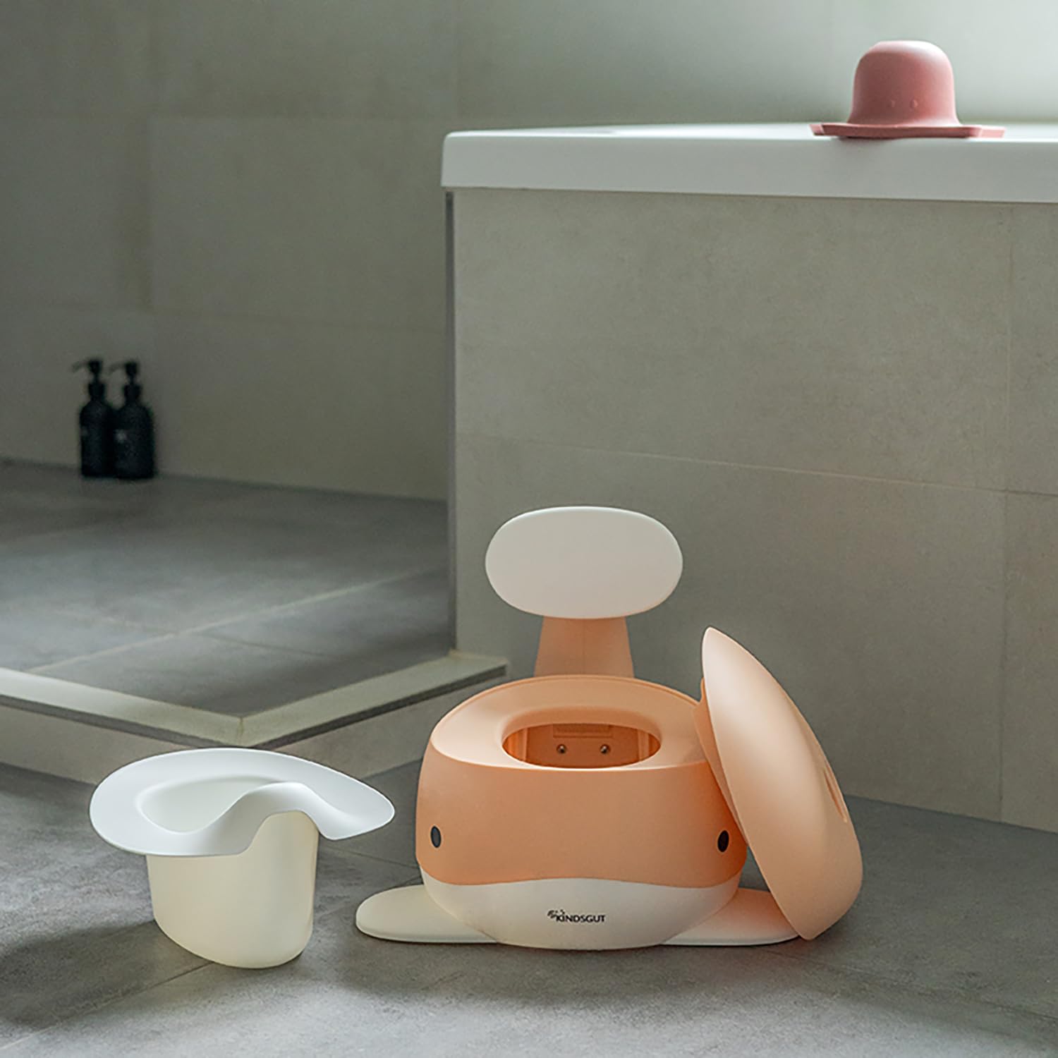 Kindsgut potty training toilet removable-inner-container peach simplifies cleaning routines.